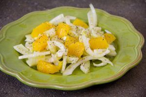 sliced fennel and cut up orange, a drizzle of oil and a sparkle of oregano; wonderful winter salad