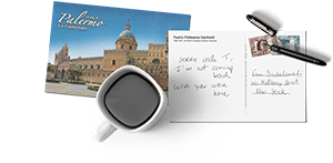 a postcard, a cup of coffee and a pen for the contact page