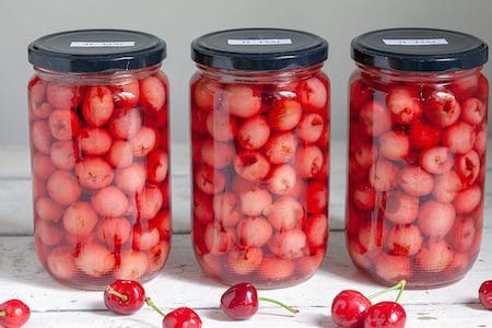 cherries sitting in alcohol