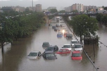 cars blocked in the flooded street